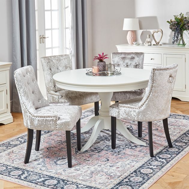 Wilmslow White Round Dining Table with 4 Silver Crushed Velvet Chairs | The Furniture Market